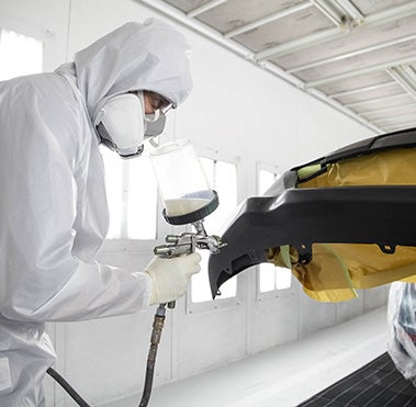 Collision Center Technician Painting a Vehicle | Jimmy Vasser Toyota of Napa in Napa CA
